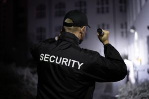 security guard patrolling at night